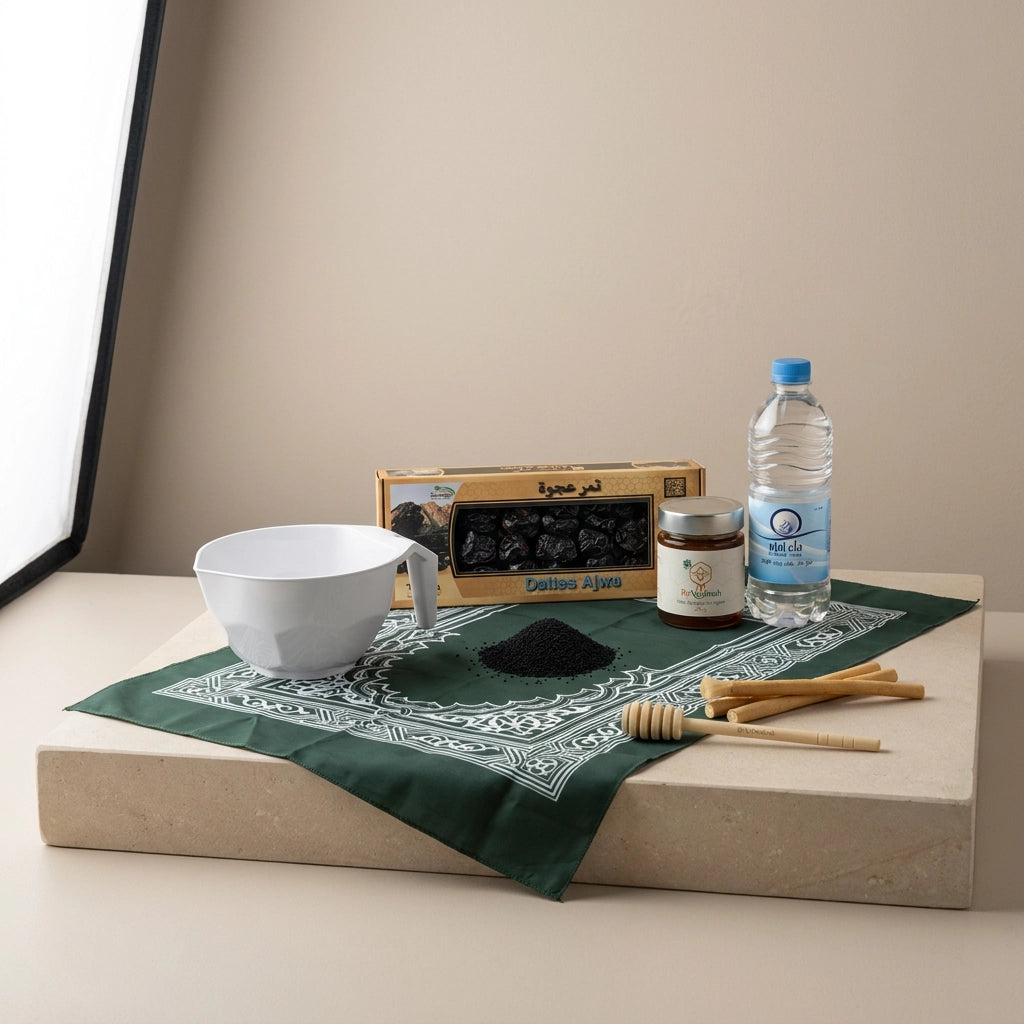 coffret sunnah essentiel avec un mudd, des siwak, une bouteille d'eau de zamzam, des dattes, un tapis de prière et un miel de nigelle avec sa cuillère