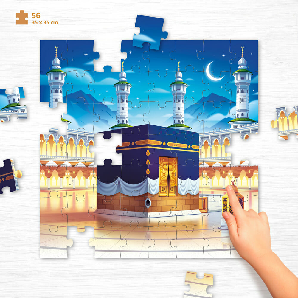 puzzle makkah avec une main qui met une pièce de puzzle